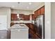This stunning kitchen features stainless steel appliances, granite countertops, and stylish cabinetry at 14814 Edgebrook Dr, Fishers, IN 46040