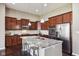 Modern kitchen with granite island, stainless steel appliances, and ample cabinet space at 14814 Edgebrook Dr, Fishers, IN 46040