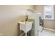 Functional laundry room featuring a sink and modern appliances at 14814 Edgebrook Dr, Fishers, IN 46040