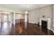 Spacious living room featuring hardwood floors, fireplace, and open access to other rooms at 14814 Edgebrook Dr, Fishers, IN 46040