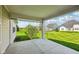 Covered patio offers a view of the landscaped backyard, perfect for relaxing and entertaining at 14814 Edgebrook Dr, Fishers, IN 46040