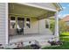Close up of a covered patio with string lights, providing a relaxing outdoor seating area at 14814 Edgebrook Dr, Fishers, IN 46040
