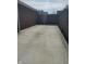 Concrete patio space in backyard, adjacent to brick building, offers durable, low-maintenance outdoor area at 1640 Lawton Ave, Columbus, IN 47201