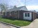 Charming brick home with well-maintained lawn and windows at 1640 Lawton Ave, Columbus, IN 47201