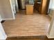 Open kitchen with wood-look laminate flooring, featuring modern appliances, ideal for cooking and entertaining at 1640 Lawton Ave, Columbus, IN 47201