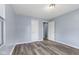Bright bedroom featuring wood-look flooring, neutral walls and white trim at 1739 N Alton Ave, Indianapolis, IN 46222