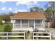 Charming single-story home with a cozy front porch and well-maintained lawn at 1739 N Alton Ave, Indianapolis, IN 46222