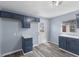 Kitchen with blue cabinetry, wood-look flooring and stainless steel hardware at 1739 N Alton Ave, Indianapolis, IN 46222