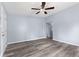 Spacious living room with gray vinyl floors and an open doorway to other rooms at 1739 N Alton Ave, Indianapolis, IN 46222
