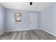 Bright living room featuring fresh paint and modern gray vinyl floors at 1739 N Alton Ave, Indianapolis, IN 46222