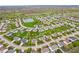Bird's eye view of a residential neighborhood highlighting homes, a pond, and lush landscaping at 1792 Salina Dr, Avon, IN 46123