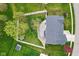Aerial perspective of a home with a large yard featuring a patio, mature trees, and privacy fencing at 1792 Salina Dr, Avon, IN 46123