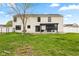 Backyard view showcasing a pergola, patio, and expansive grassy area perfect for outdoor activities at 1792 Salina Dr, Avon, IN 46123