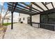 Relaxing stamped concrete patio featuring a pergola, outdoor storage, and backyard access at 1792 Salina Dr, Avon, IN 46123