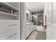 Stylish bathroom with tiled shower, modern vanity, and decorative black-and-white floor at 1792 Salina Dr, Avon, IN 46123