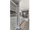Bathroom with dual sinks, decorative tile floor, tiled shower with glass doors and closet at 1792 Salina Dr, Avon, IN 46123