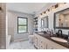 Bathroom features double sinks, decorative lighting, geometric tile, and a frosted window at 1792 Salina Dr, Avon, IN 46123