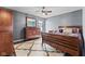 Bedroom with a wood-framed bed, wood dresser and matching nightstand, and a large rug at 1792 Salina Dr, Avon, IN 46123