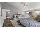 Bright bedroom with high ceilings, ceiling fan, television and large rug at 1792 Salina Dr, Avon, IN 46123