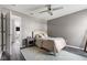 A comfortable bedroom with gray walls, wood floors, and stylish decor at 1792 Salina Dr, Avon, IN 46123