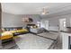 Spacious bedroom with a vaulted ceiling, large sectional sofa, and neutral decor at 1792 Salina Dr, Avon, IN 46123