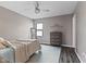 Bedroom with stylish furnishings, a modern ceiling fan, and ample natural light at 1792 Salina Dr, Avon, IN 46123