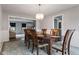 Formal dining room with traditional wood furniture and views into a connecting living room at 1792 Salina Dr, Avon, IN 46123