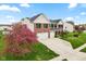 Charming two-story home with brick facade, manicured lawn, and attached two-car garage at 1792 Salina Dr, Avon, IN 46123