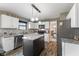 Well-equipped kitchen with stainless steel appliances and breakfast bar featuring views to dining area at 1792 Salina Dr, Avon, IN 46123