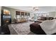 Spacious living room featuring a fireplace, comfortable seating, and an open layout to the kitchen at 1792 Salina Dr, Avon, IN 46123
