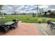 Backyard with deck featuring patio furniture, landscaping, and fire pit at 18017 Gasparilla Ct, Westfield, IN 46062