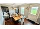 Cozy dining room is furnished with wood table, chairs, chandelier, and natural light at 18017 Gasparilla Ct, Westfield, IN 46062