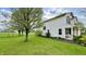Charming two-story home with well-maintained lawn, beautiful flowering tree, and inviting front porch seating area at 18017 Gasparilla Ct, Westfield, IN 46062