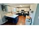 The kitchen features painted cabinets, a countertop bar, modern appliances, and updated lighting at 18017 Gasparilla Ct, Westfield, IN 46062