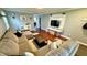 Comfortable living room showcasing a sectional sofa, wood floors, and a wall-mounted television at 18017 Gasparilla Ct, Westfield, IN 46062
