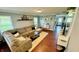Cozy living room featuring a large sectional sofa, hardwood floors, and neutral-colored walls at 18017 Gasparilla Ct, Westfield, IN 46062
