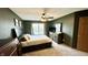 The spacious main bedroom offers carpet floors, natural light, and a ceiling fan at 18017 Gasparilla Ct, Westfield, IN 46062