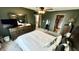 A Primary bedroom with carpet floors, ceiling fan, an ensuite bathroom, and natural lighting at 18017 Gasparilla Ct, Westfield, IN 46062