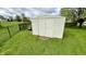 Convenient backyard storage shed with double doors, ideal for storing outdoor equipment and maintaining a tidy yard at 18017 Gasparilla Ct, Westfield, IN 46062