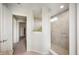 Bathroom view of tiled shower with glass partition, neutral walls, and an open doorway at 18488 Jaden Dr, Westfield, IN 46062