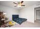 Inviting bedroom with a ceiling fan, a plush bed with a colorful comforter, and a playful rug at 18488 Jaden Dr, Westfield, IN 46062