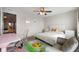 Light-filled bedroom with a soft bed, a desk space, and a sitting area for relaxation at 18488 Jaden Dr, Westfield, IN 46062