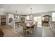 Spacious dining room that flows into the kitchen, featuring an elegant light fixture and ample seating at 18488 Jaden Dr, Westfield, IN 46062