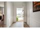Inviting entryway featuring neutral walls, modern flooring, and an open door to the bright outdoors at 18488 Jaden Dr, Westfield, IN 46062