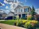 Beautiful two-story home with blue and dark siding, a lush front yard, and a welcoming front porch at 18488 Jaden Dr, Westfield, IN 46062