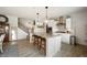 Modern kitchen with a granite island, stainless steel appliances, and stylish pendant lighting at 18488 Jaden Dr, Westfield, IN 46062