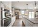 Modern kitchen with stainless steel appliances and a large island at 18488 Jaden Dr, Westfield, IN 46062