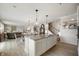 Open concept kitchen with granite counters and view of the dining and living area at 18488 Jaden Dr, Westfield, IN 46062