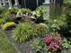 Beautifully landscaped garden with a variety of colorful flowers and plants at 18488 Jaden Dr, Westfield, IN 46062