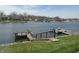 Spacious backyard with a dock and direct access to the serene lake at 1959 Crystal Bay East Dr, Plainfield, IN 46168